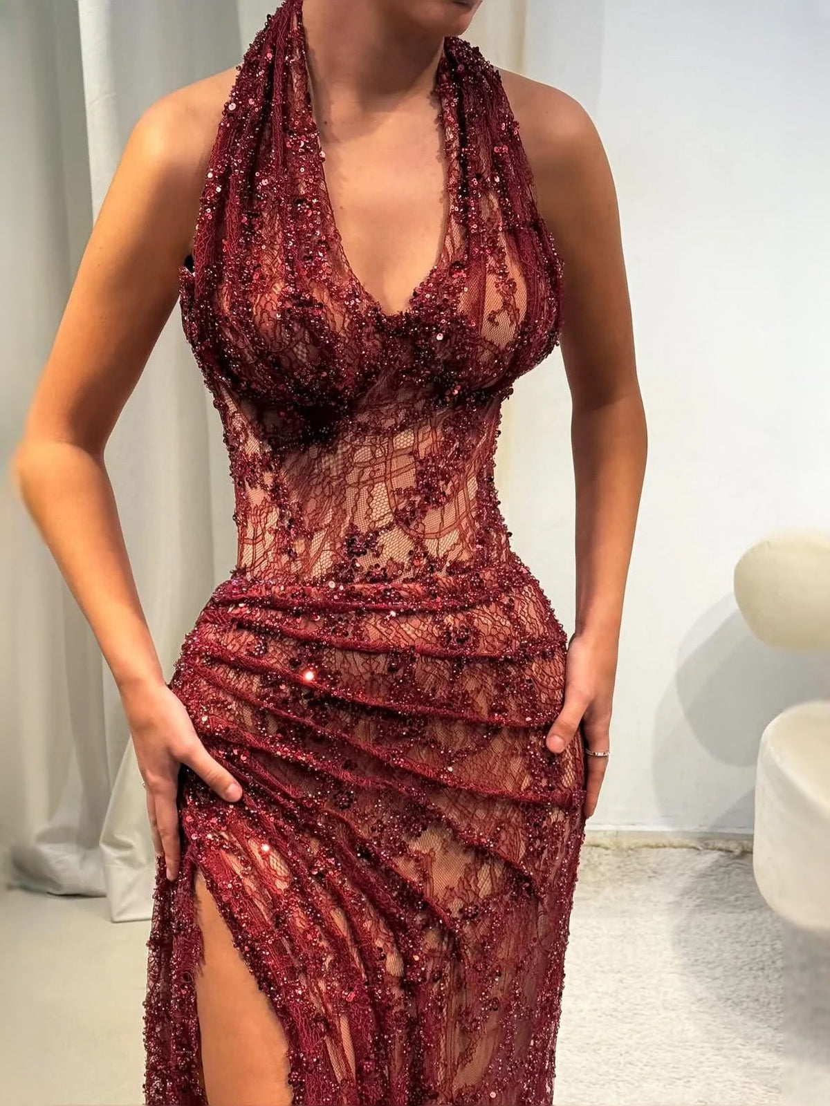Deep red sequin mermaid prom dress with deep V-neck, lace bodice, side slit, floor length
