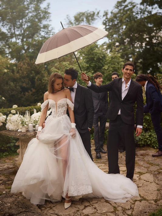 Ivory A-line wedding dress with floral lace corset, V-neck, and layered tulle skirt