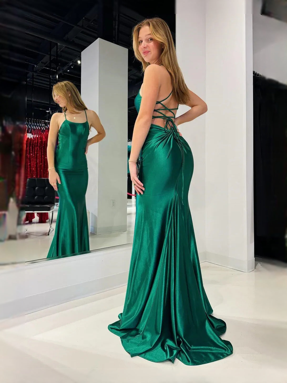 Emerald green satin mermaid gown with square neckline and draped ruched bodice