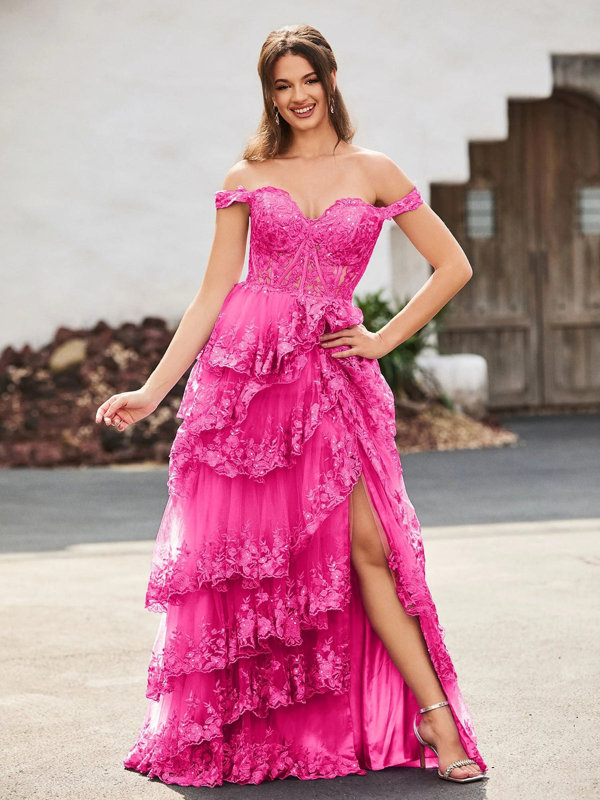 Coral pink off-shoulder sweetheart corset prom dress with ruffled layers and slit