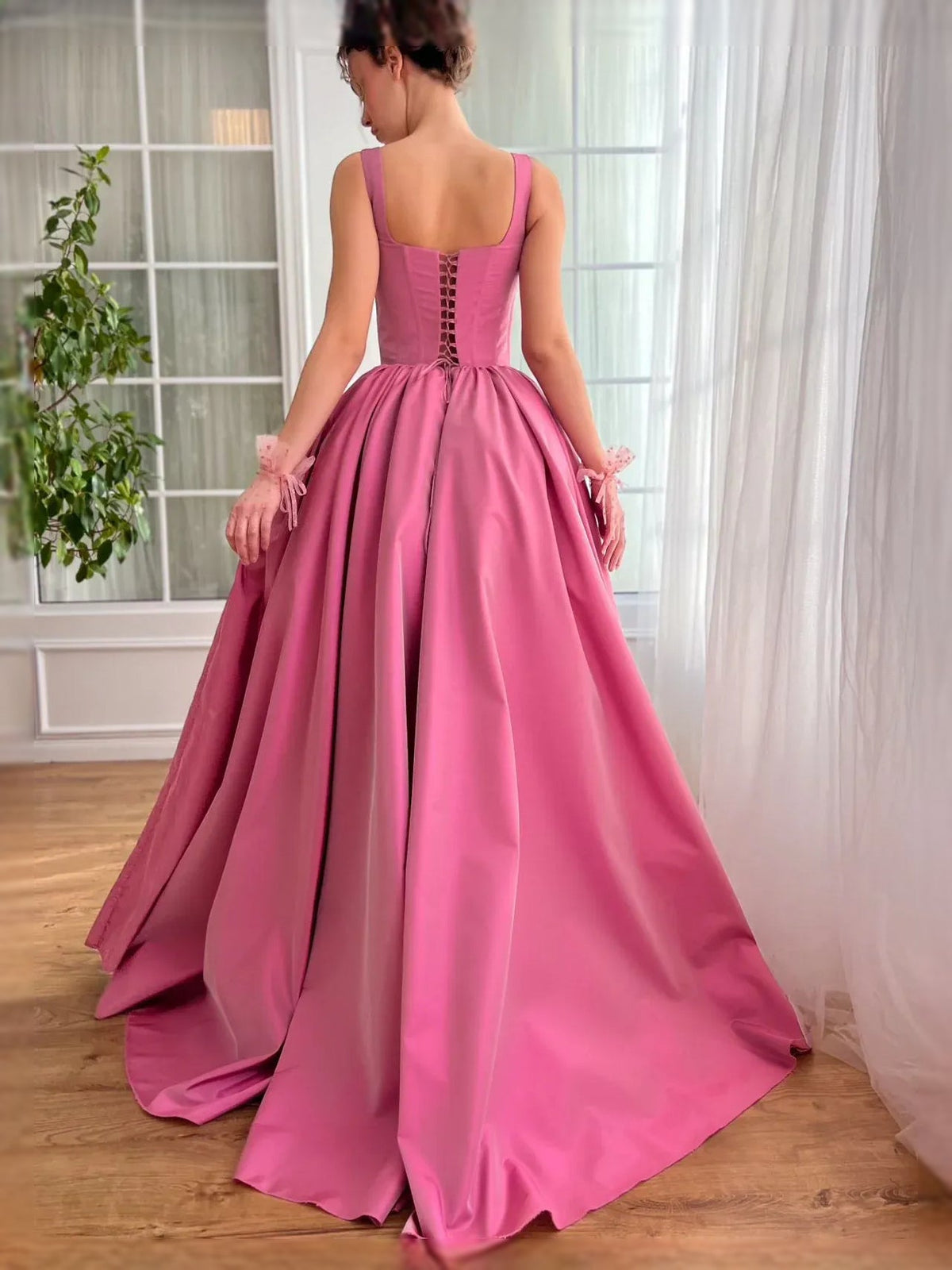 Hot pink satin corset-style A-line maxi dress with sleeveless back detail
