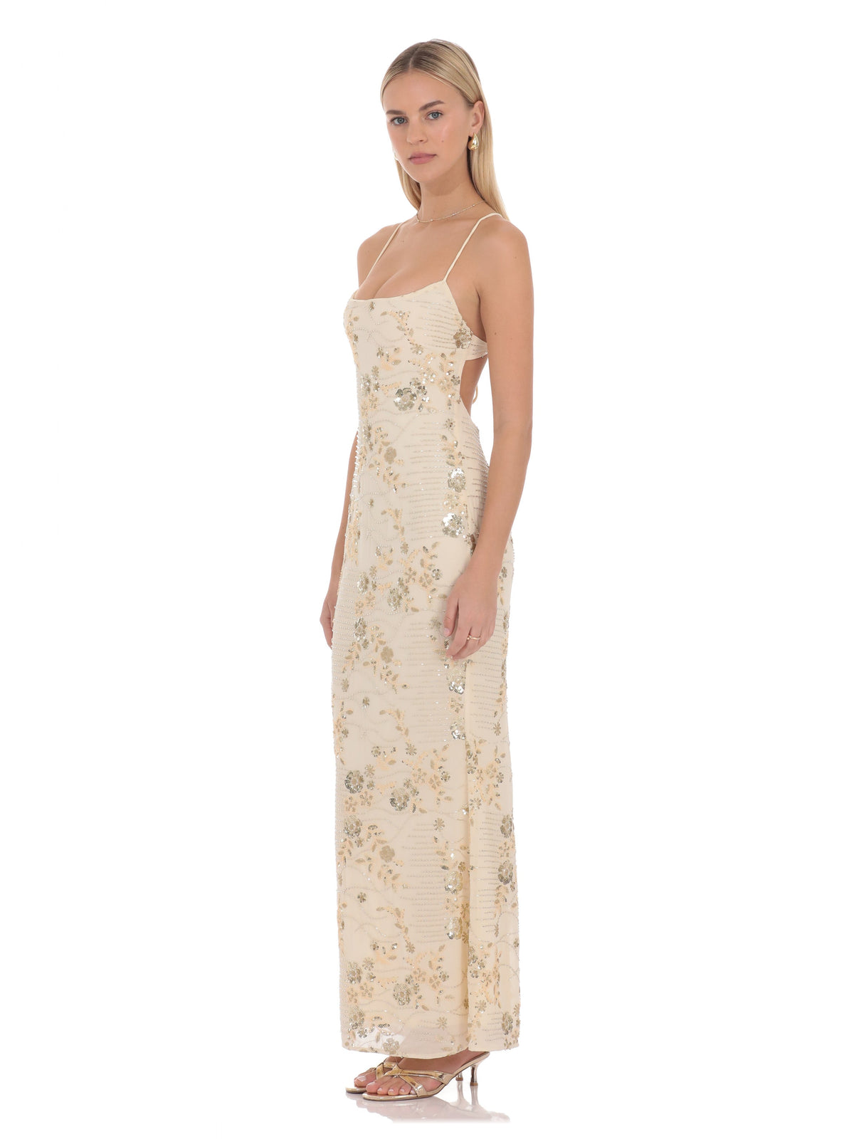 Cream A-line maxi bridesmaid dress with spaghetti straps and sequin floral detailing