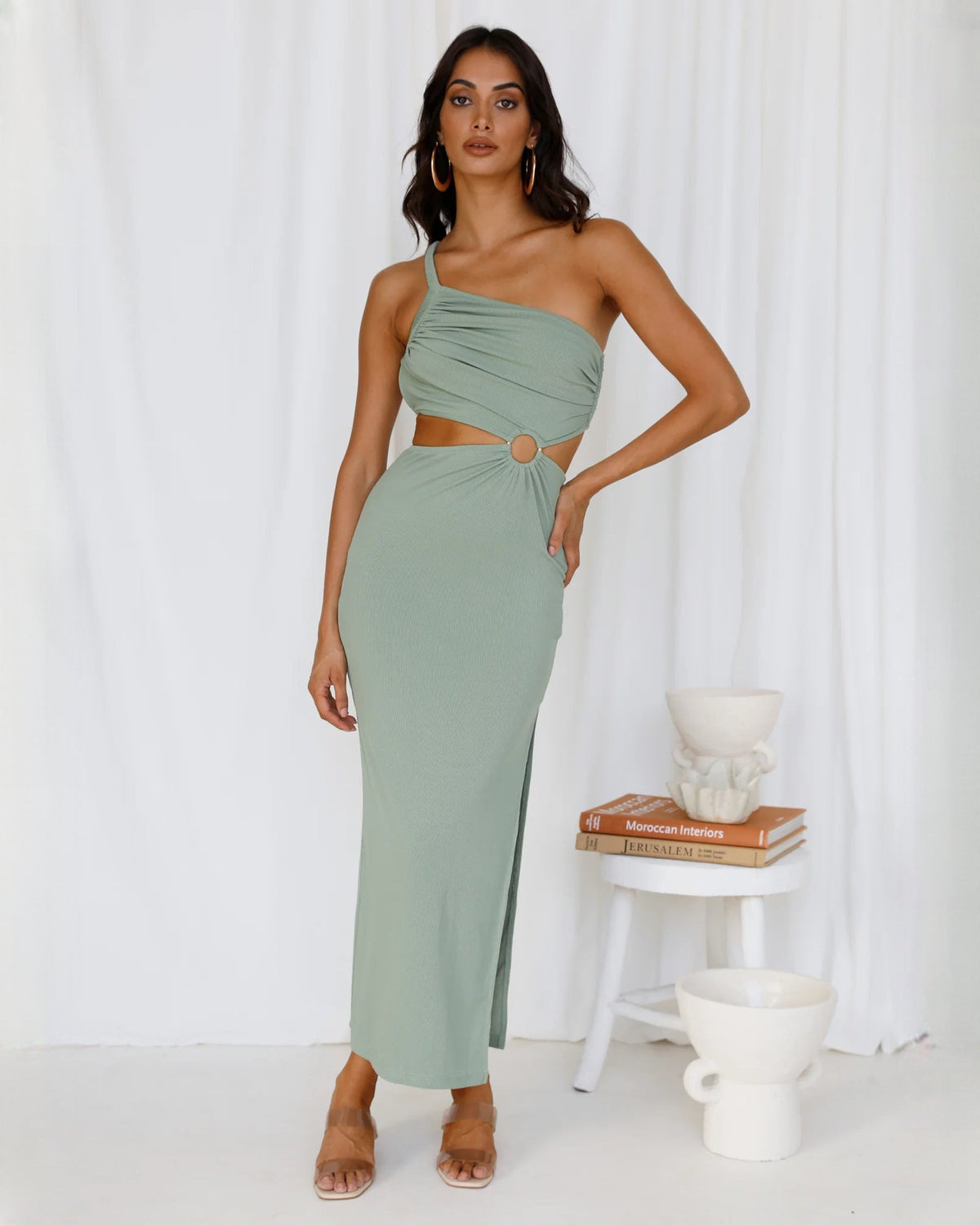 Sage green sleeveless one-shoulder maxi dress with draped bodice, waist cutout, side slit