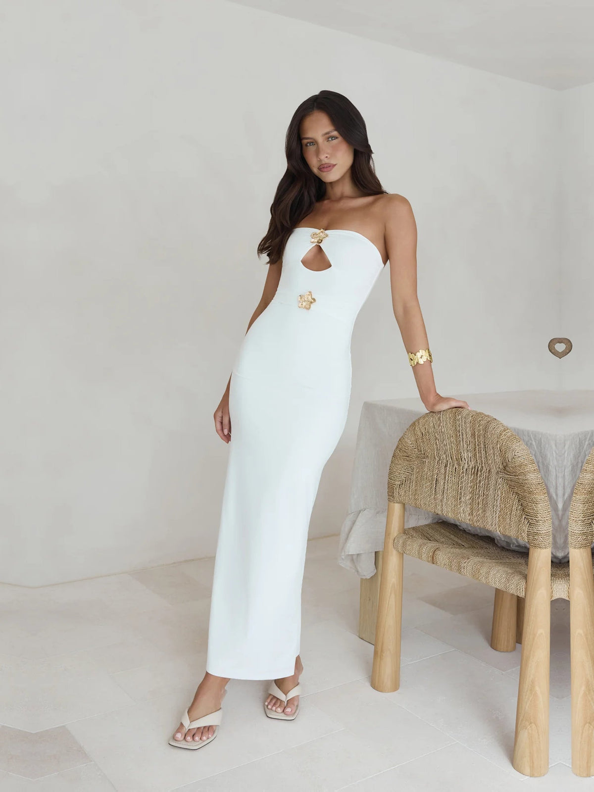 White a-line maxi formal dress with strapless neckline, full-length front view
