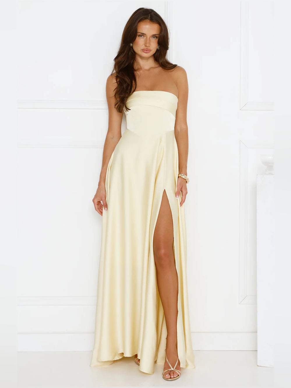 Yellow a-line maxi formal dress with strapless neckline, full-length front view