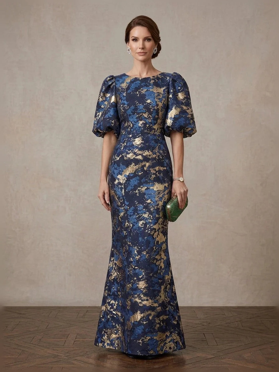 Navy blue v-neck mermaid gown with gold floral print, short puff sleeves, floor length