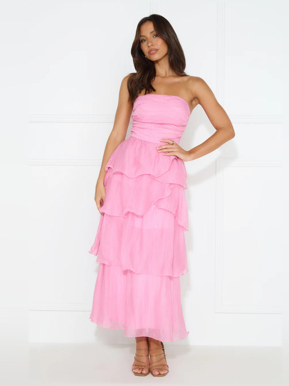 Pink midi formal dress with strapless neckline, full-length front view