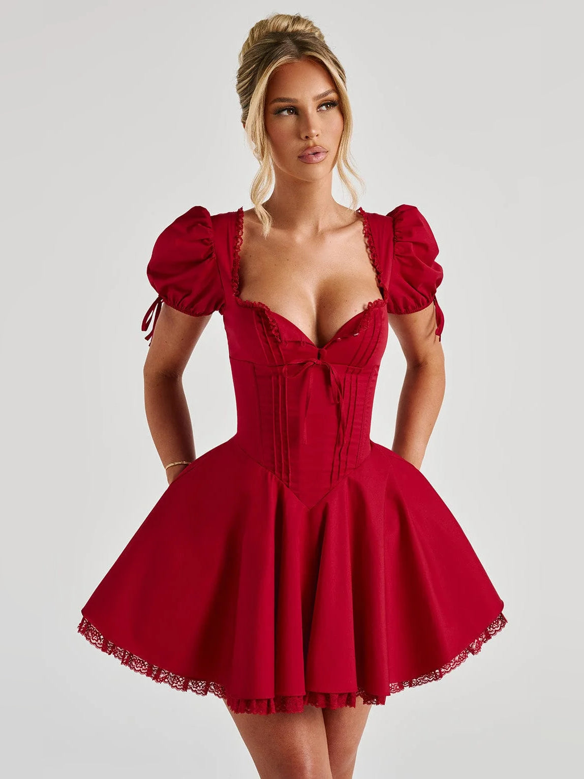 Red mini dress with square neckline, puff sleeves, corset-style bodice, flared skirt