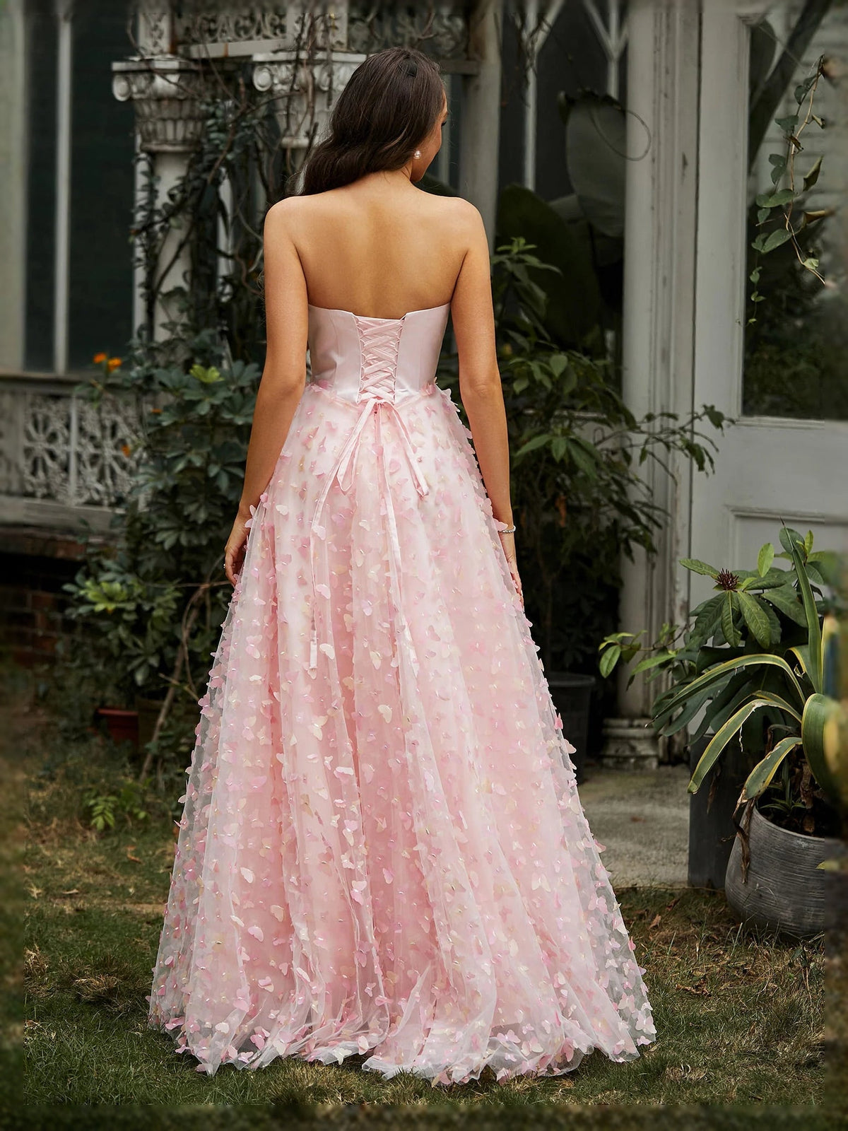 Pink floral-applique backless ball gown with sweetheart neckline and floor-length skirt