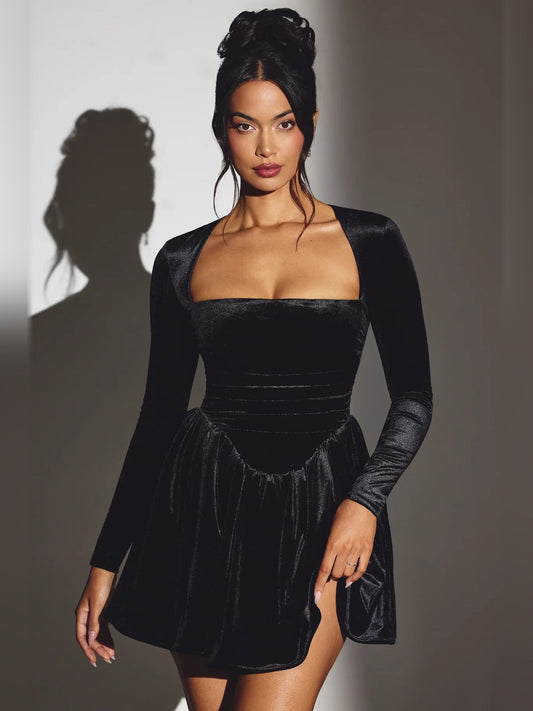 Black velvet corset mini dress with long sleeves, square neckline, and flared skirt