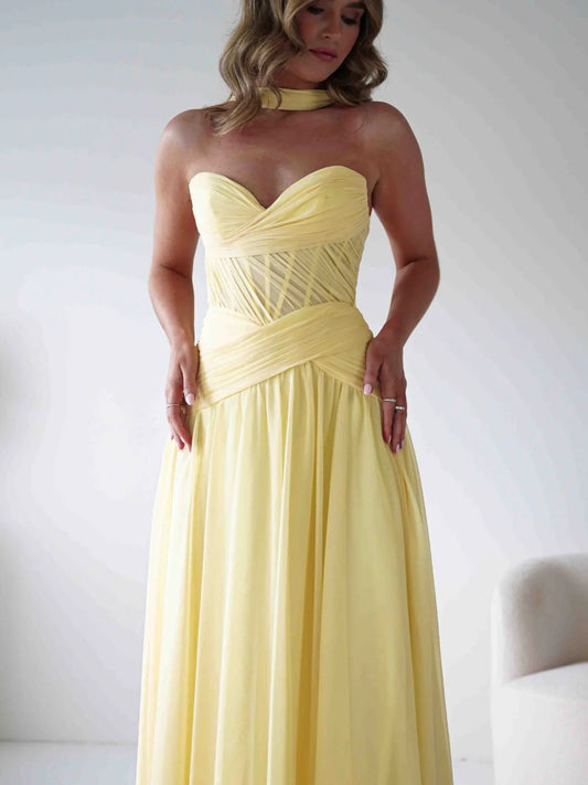Yellow sweetheart A-line chiffon prom dress with corset-style bodice and draped waist