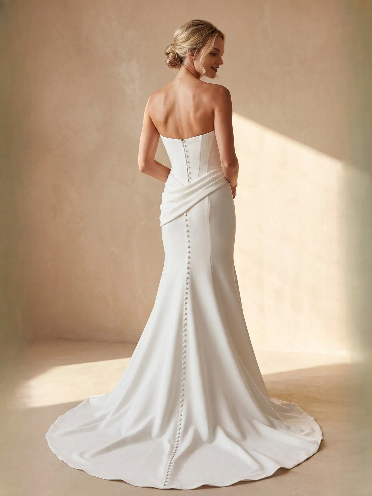 Ivory satin mermaid wedding dress with draped corset bodice, back cutout and boning