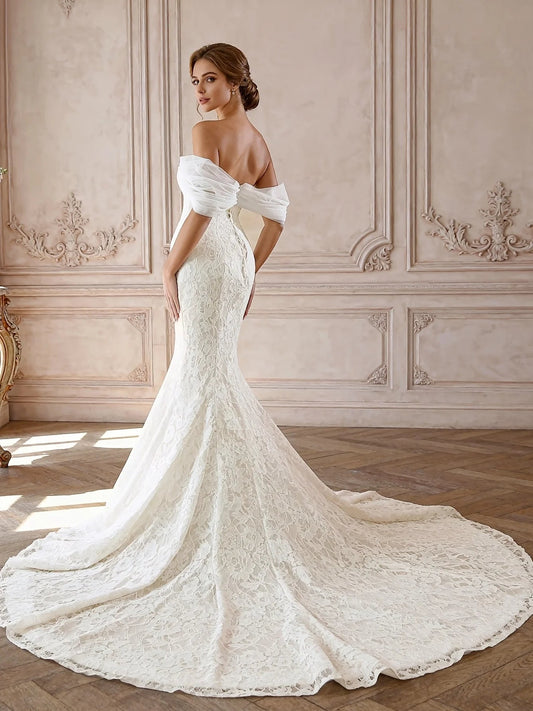 Ivory off-shoulder lace mermaid wedding dress with draped sleeves and extended train