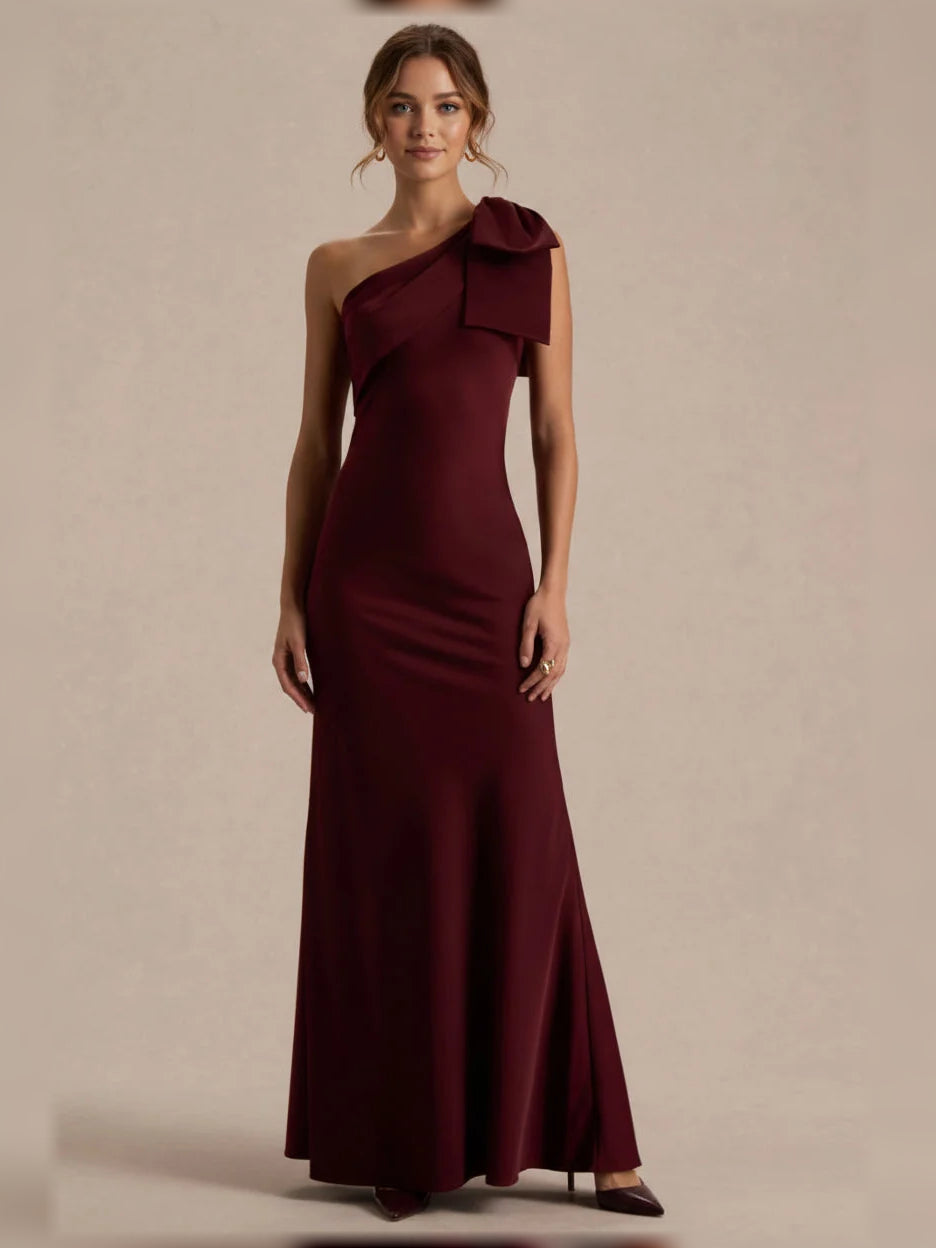 Burgundy one-shoulder satin mermaid bridesmaid dress with draped bow detail