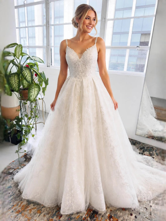 Ivory V-neck ball-gown wedding dress with beaded floral lace bodice and tulle skirt