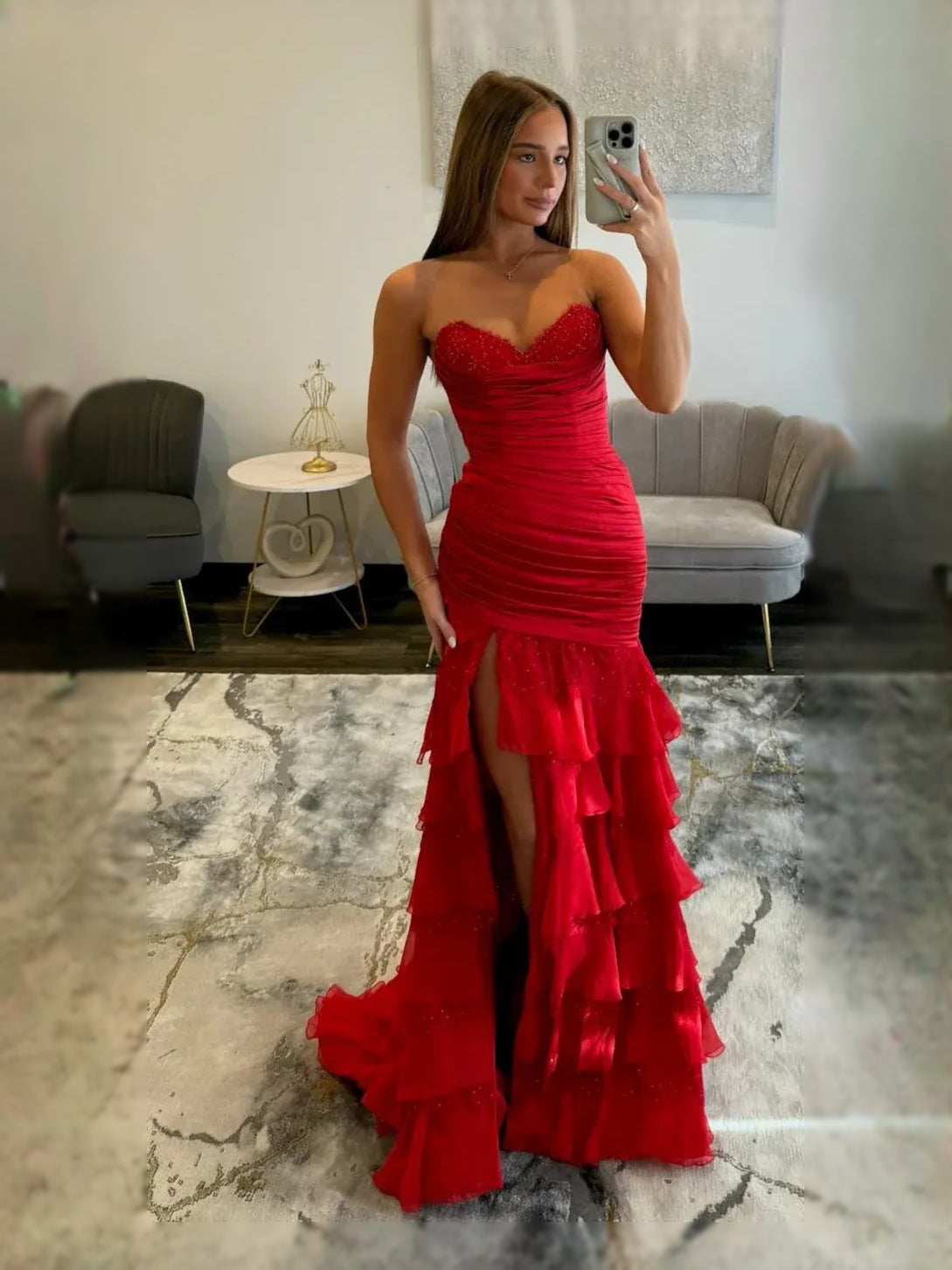 Red ruched sweetheart corset prom dress with ruffled tulle skirt and slit
