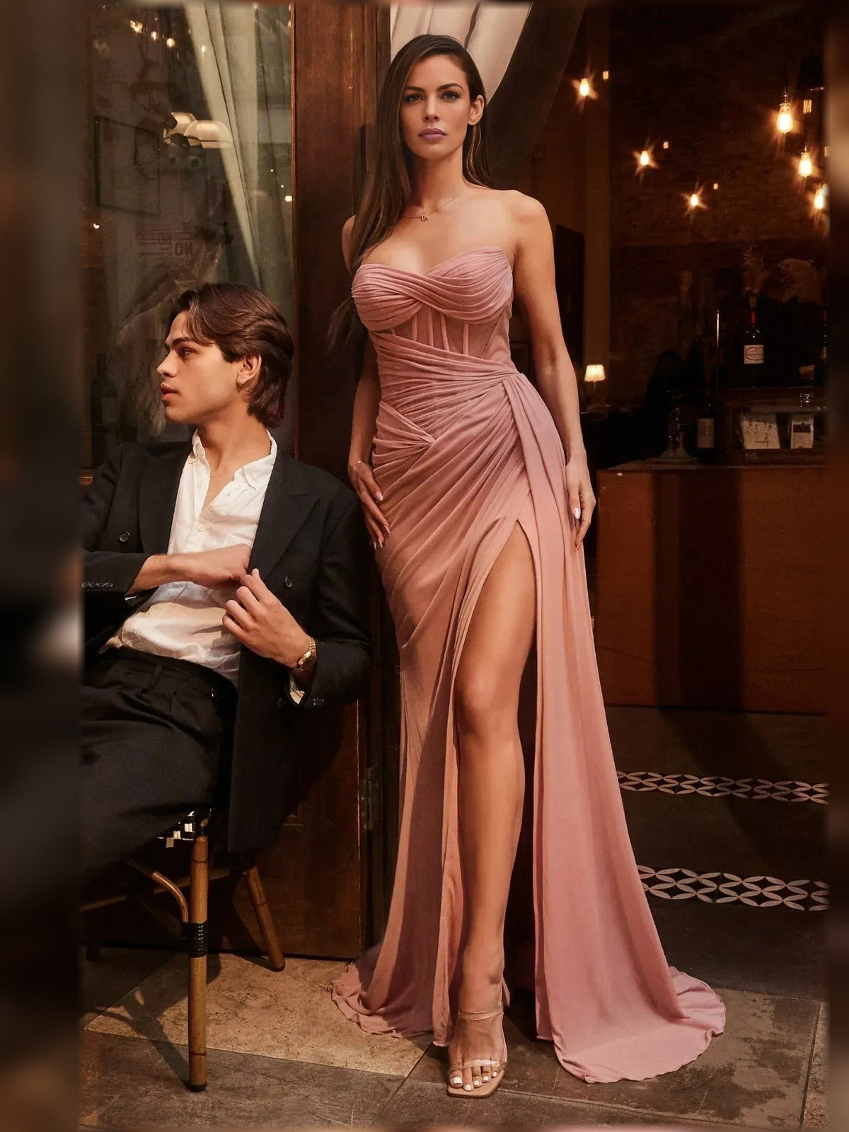 Peach strapless corset formal dress with draped ruching and thigh-high front slit