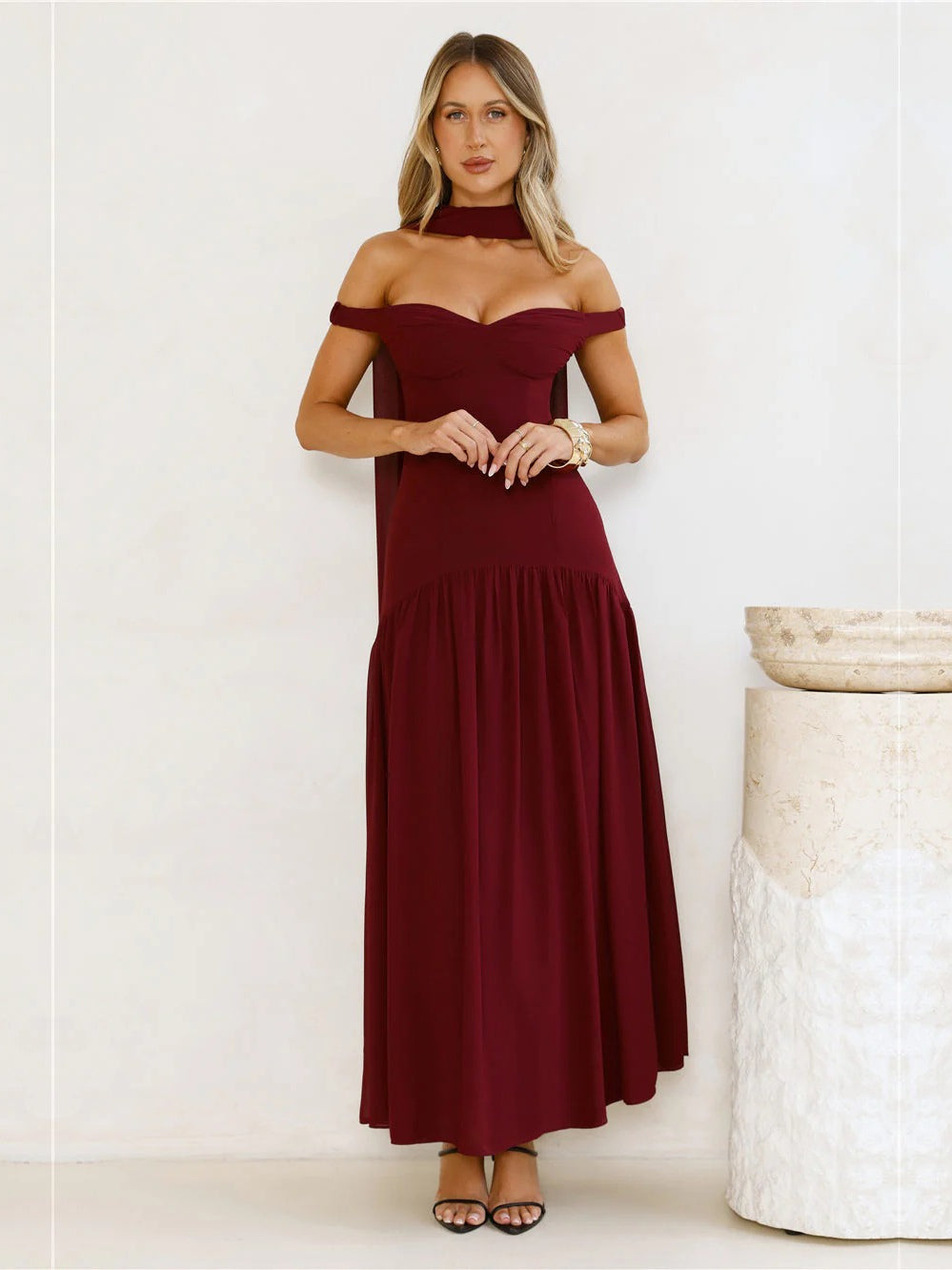 Burgundy a-line maxi formal dress with off-the-shoulder neckline, full-length front view