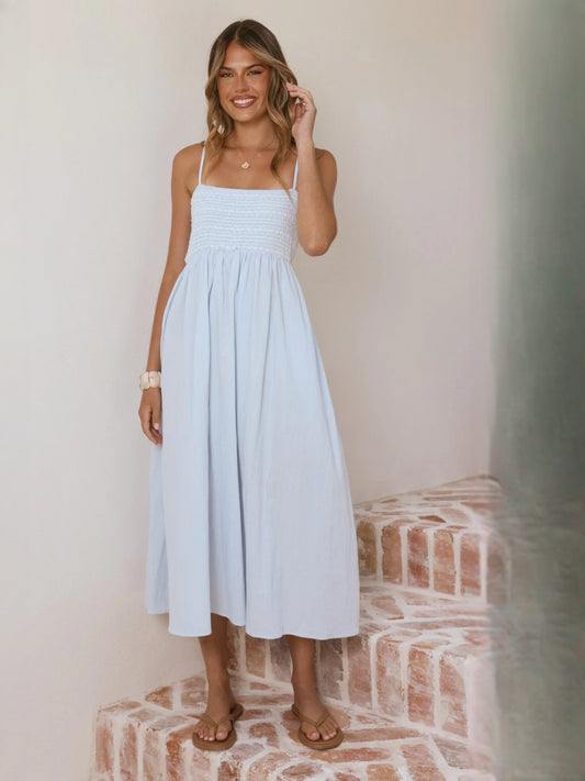 Light blue midi dress with spaghetti straps and smocked bodice, gathered skirt