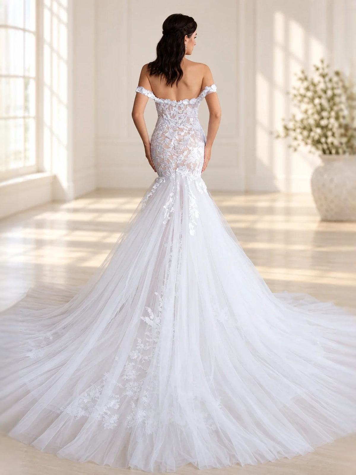 White wedding dress, back view: sweetheart bodice with floral applique, layered mermaid skirt