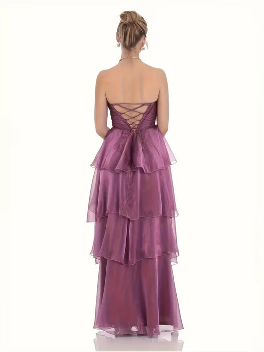 Purple sweetheart A-line wedding dress with tiered ruffle layers and crisscross back