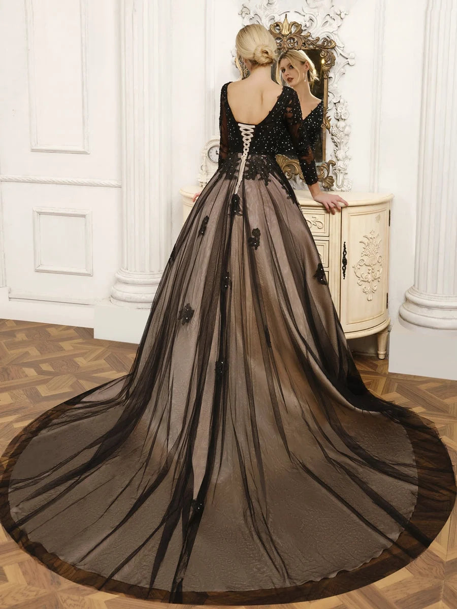 Black V-neck corset-style tulle wedding dress with long sleeves and layered A-line skirt