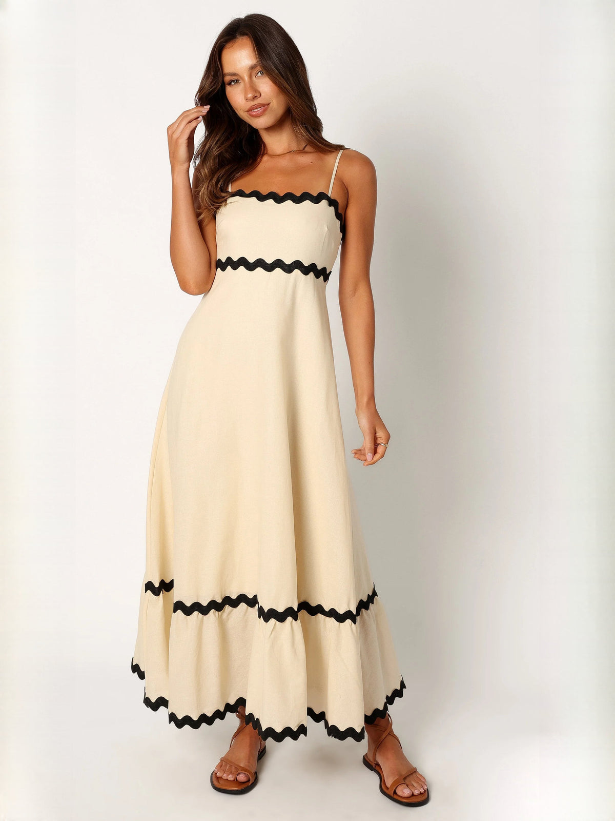 Black a-line maxi formal dress with strapless neckline, full-length front view