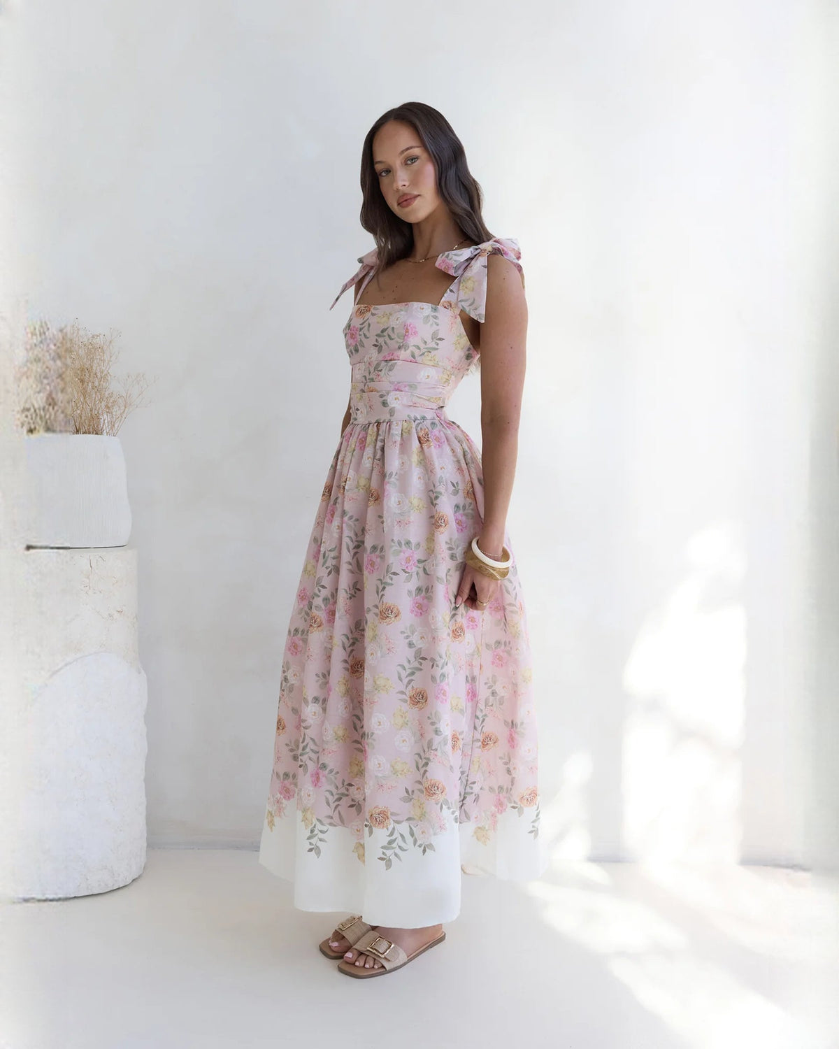 Pink floral sleeveless satin A-line maxi dress with gathered waist and bow shoulder ties