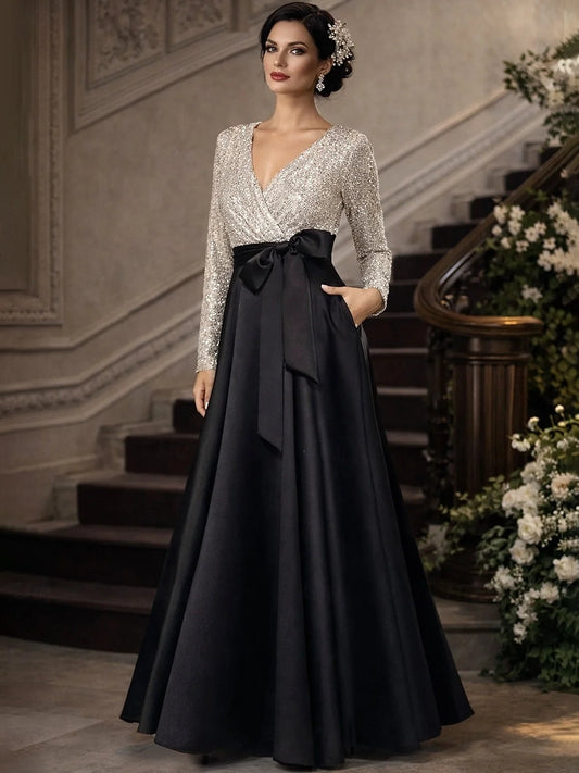 Silver sequin V-neck A-line floor-length dress with black satin waist bow
