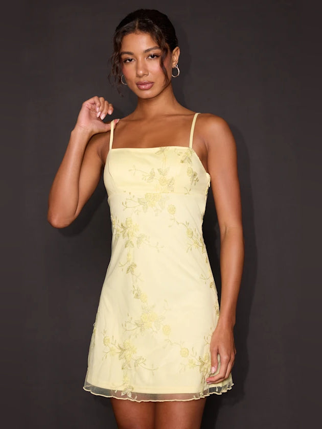Butter yellow embroidered sleeveless mini dress with spaghetti straps and scalloped hem