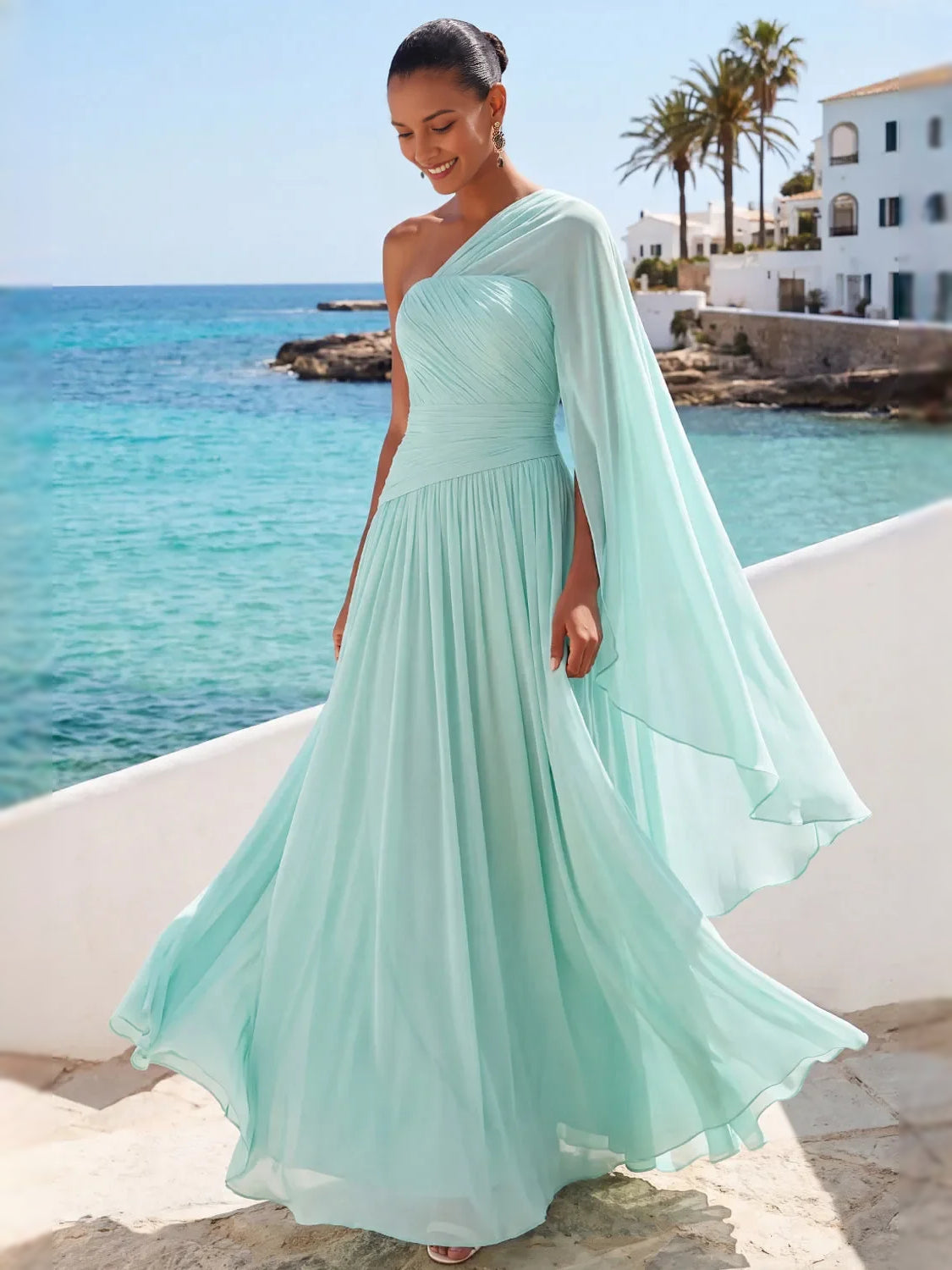 Mint green one-shoulder chiffon maxi dress with draped cape sleeves and A-line skirt.