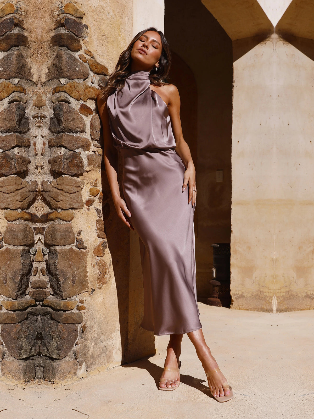 Brown sheath maxi formal dress with halter neckline, full-length front view
