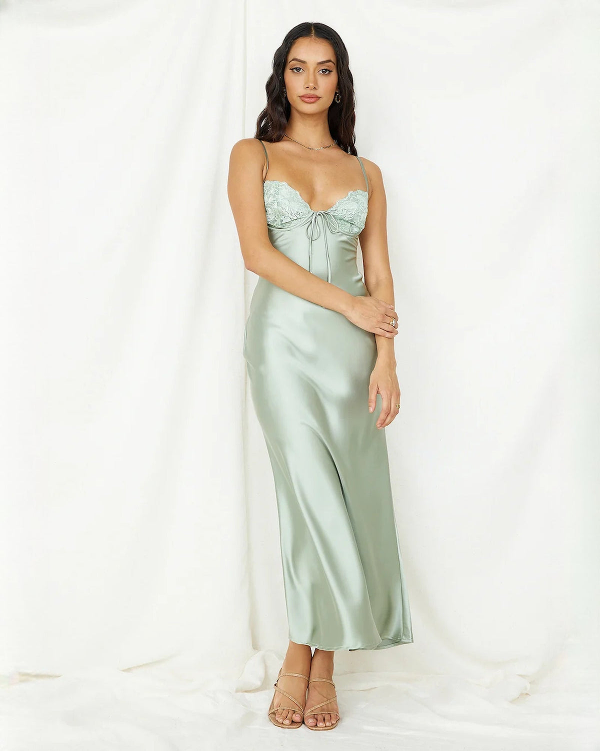 Mint green satin midi bridesmaid dress with lace bodice, spaghetti straps, tie neckline