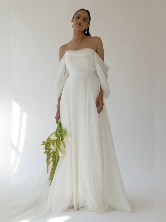 Ivory A-line floor-length formal dress with strapless sweetheart neckline and draped sleeves