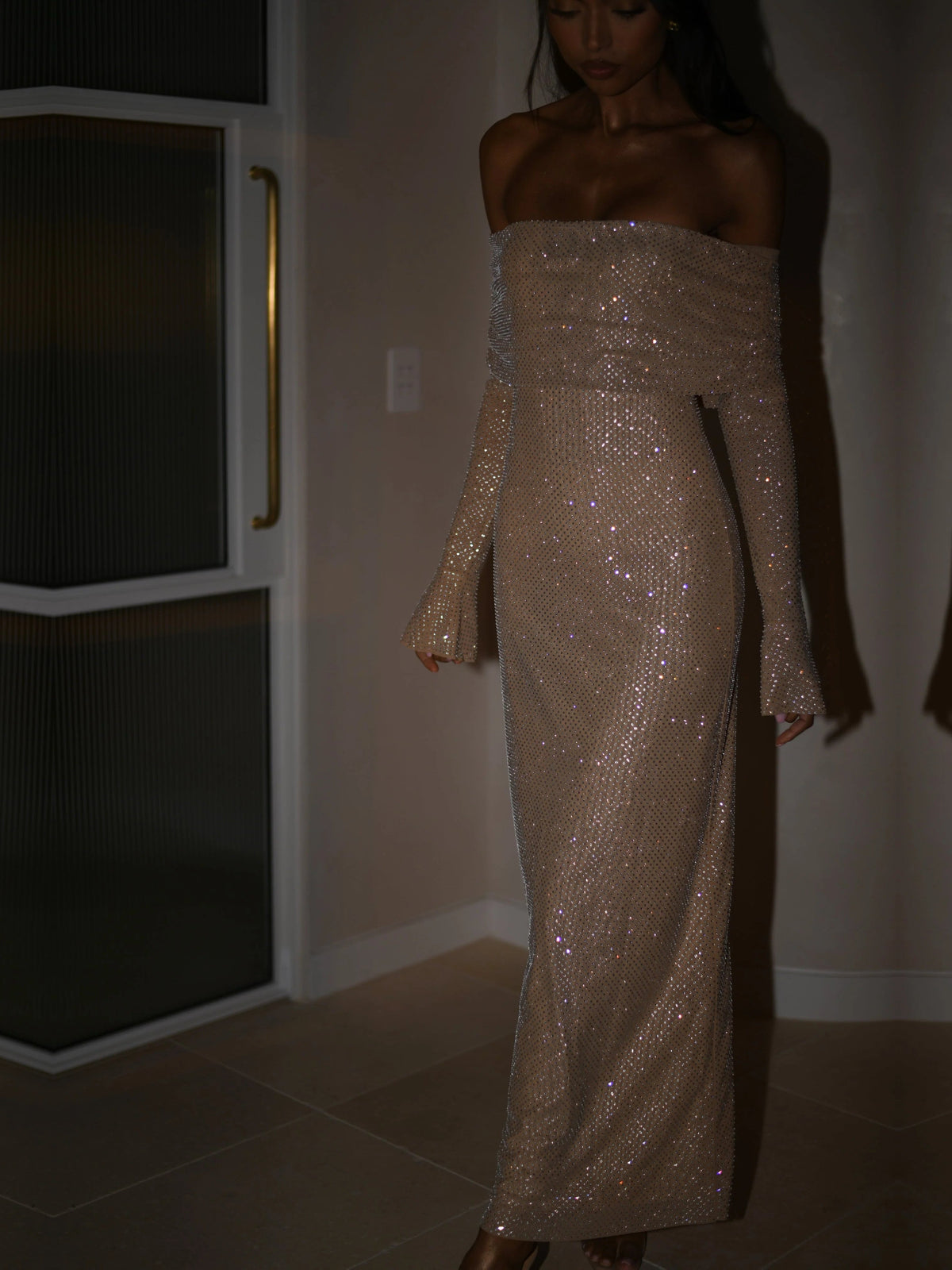 Nude sheath maxi formal dress with off-the-shoulder neckline, full-length front view