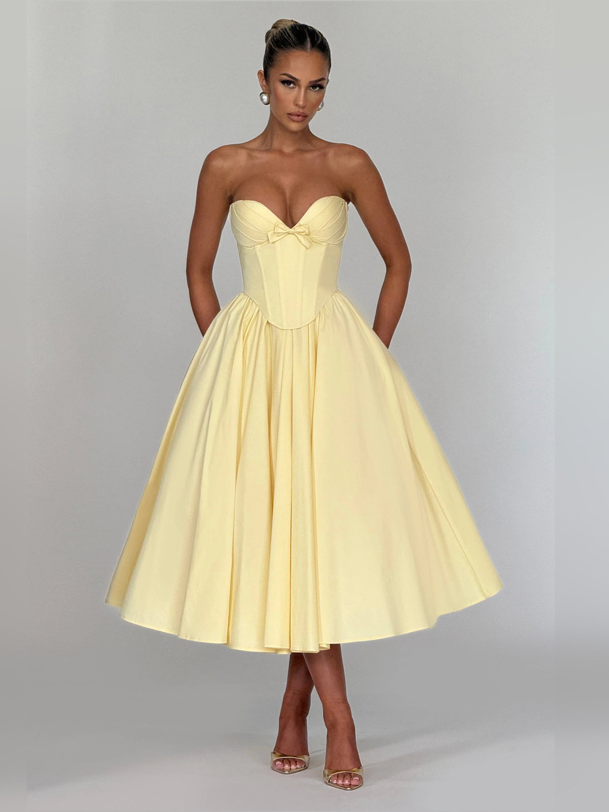Lemon yellow strapless sweetheart midi formal dress with corset bodice and pleated skirt