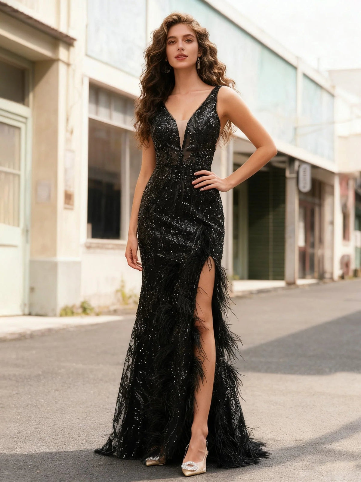 Black V-neck sequin formal gown, open back, side slit with fringe