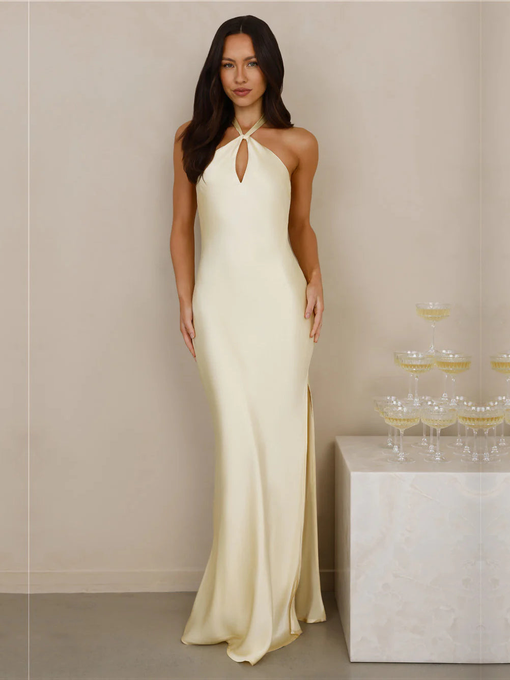 Yellow sheath maxi formal dress with halter neckline, full-length front view