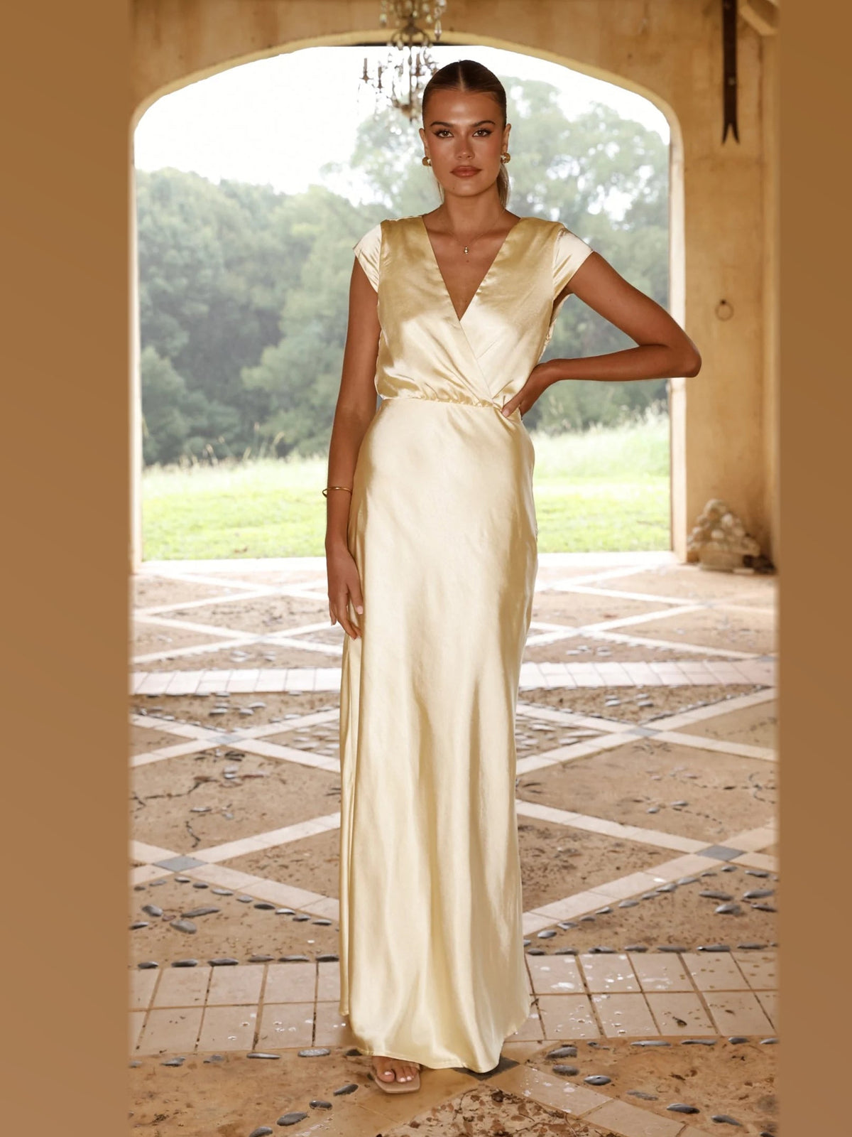 Yellow maxi formal dress, front full-length view showing the neckline