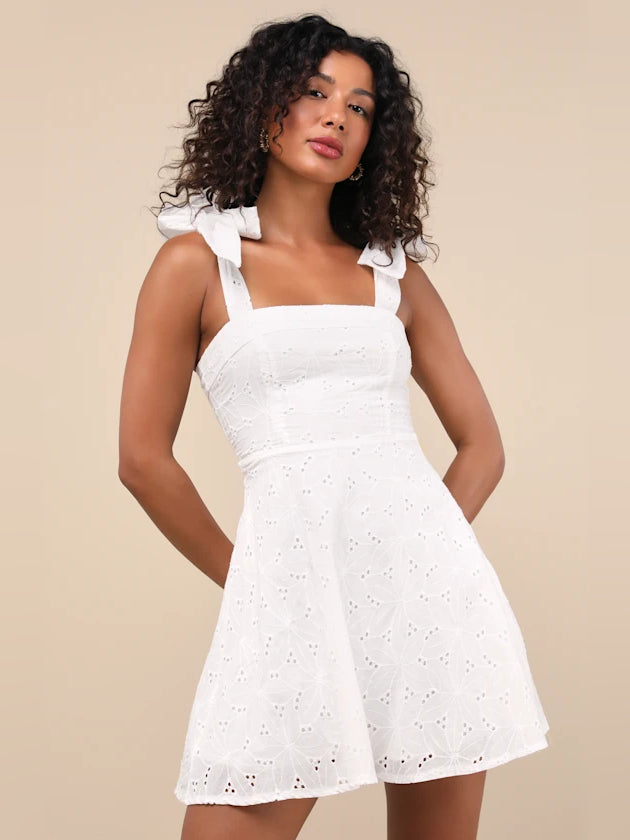 White embroidered mini homecoming dress with square neckline and bow straps