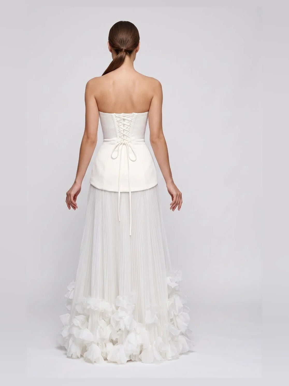 Ivory strapless corset-style wedding dress, lace-up back, layered tulle A-line skirt
