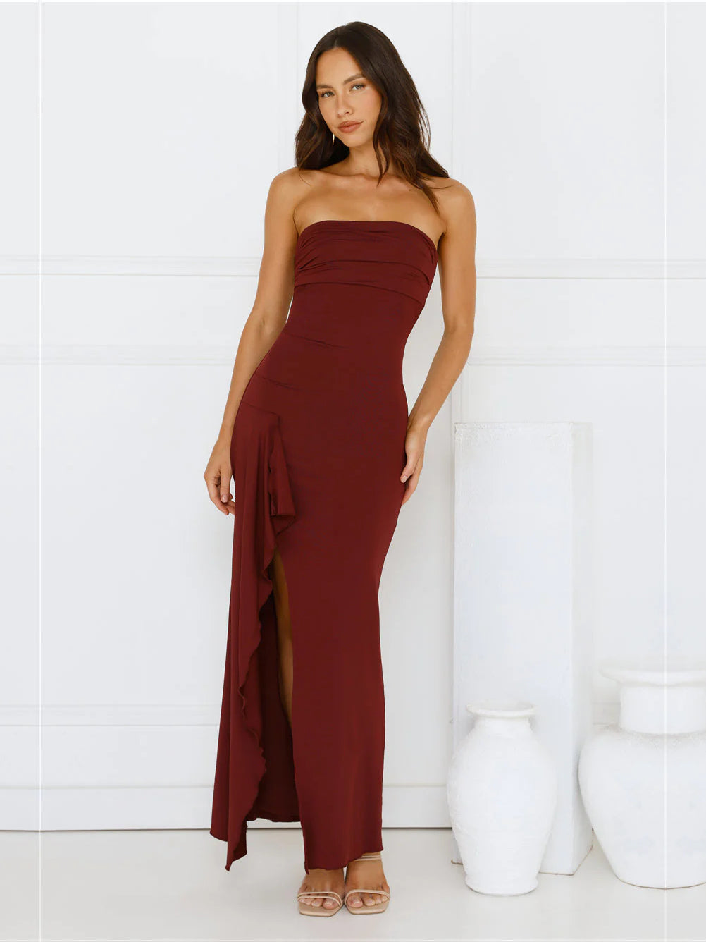 Burgundy sheath maxi formal dress with strapless neckline, full-length front view