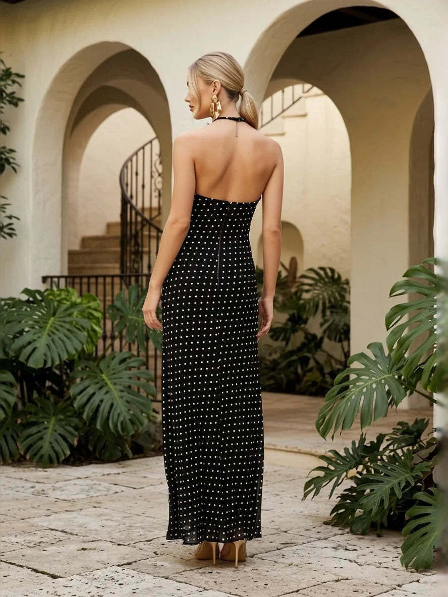Black halter neck maxi dress with white speckled pattern, open back