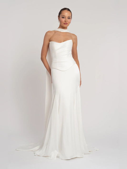 Ivory strapless A-line floor-length formal dress with draped bodice and layered skirt