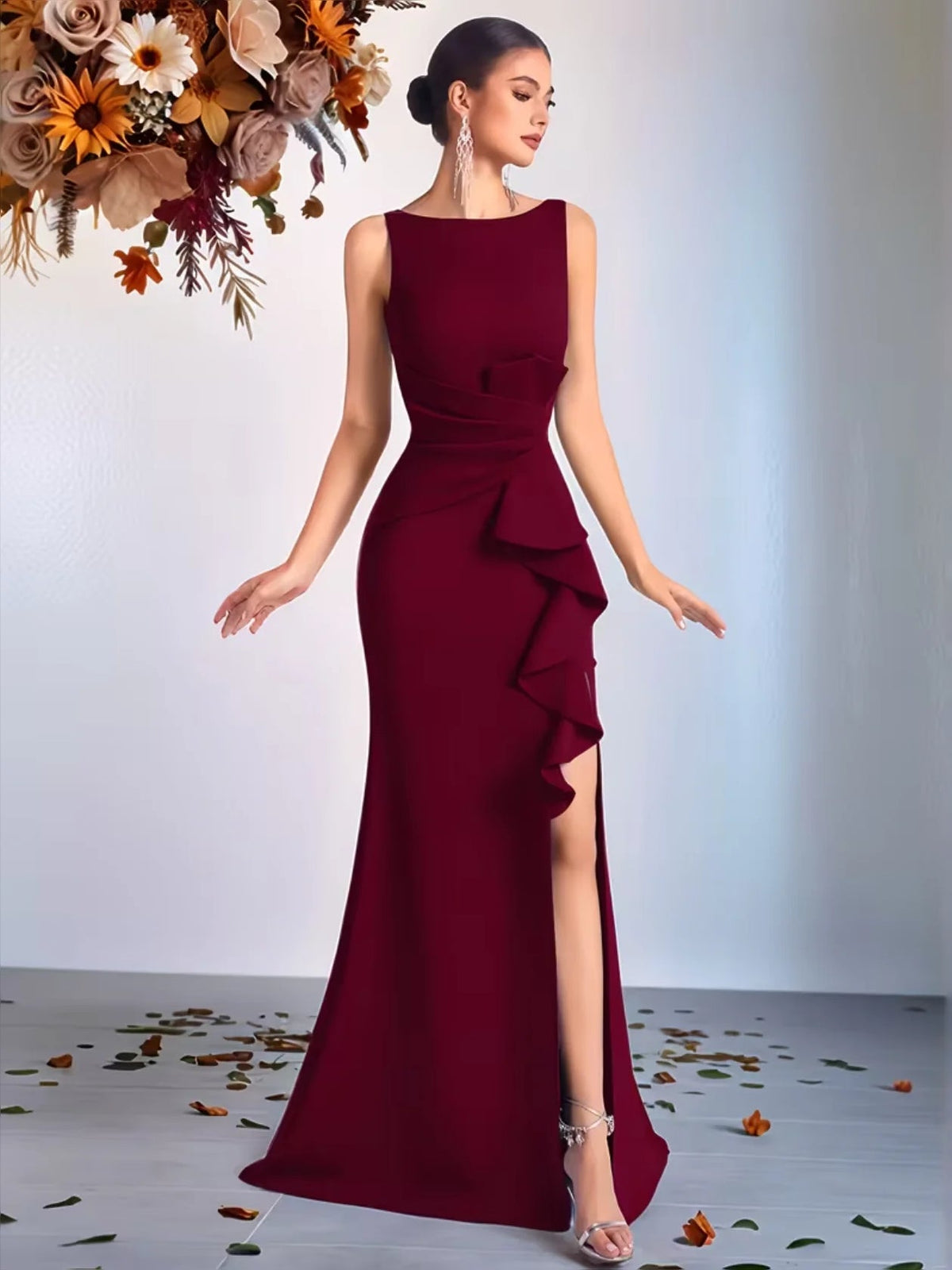 Floor-length crimson red sleeveless prom dress with round neck, peplum ruffles, side slit
