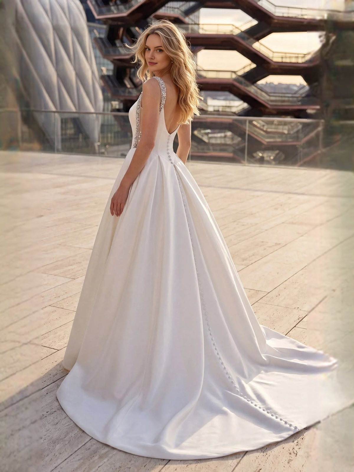 White satin A-line wedding dress with sweetheart neckline and beaded crystal straps