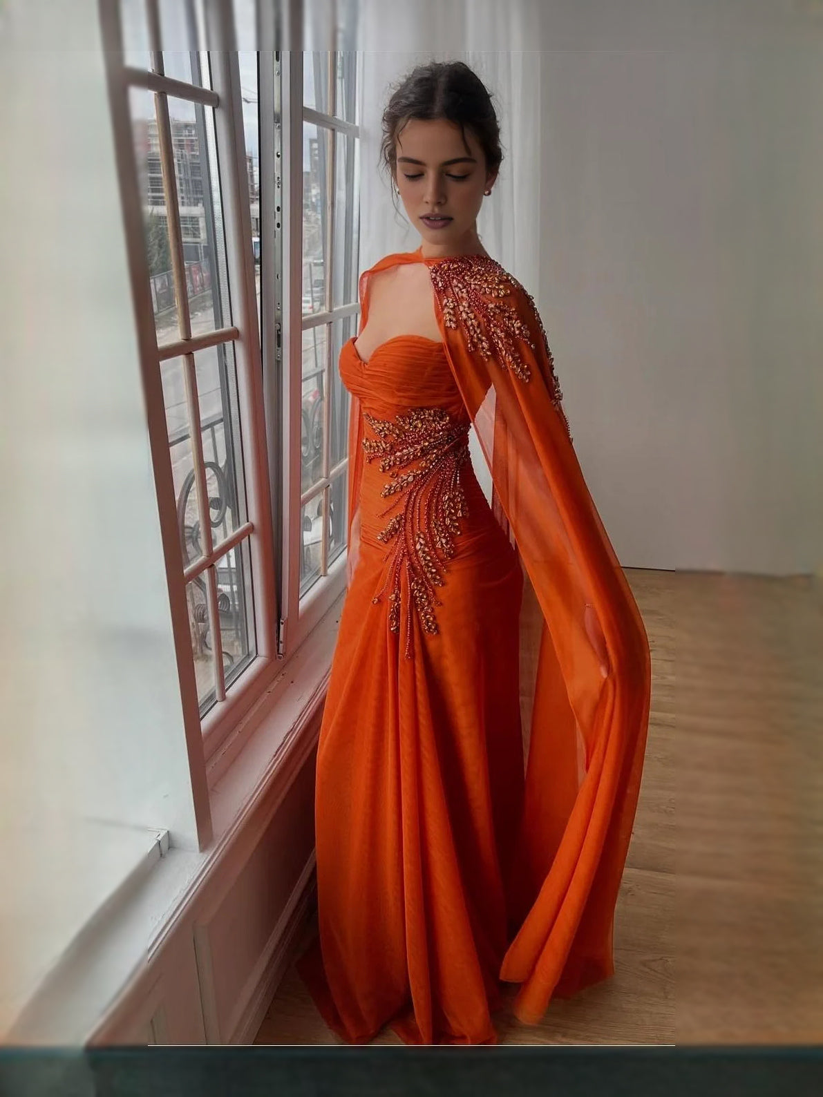 Burnt orange sweetheart mermaid prom dress with ruched bodice and beaded accents