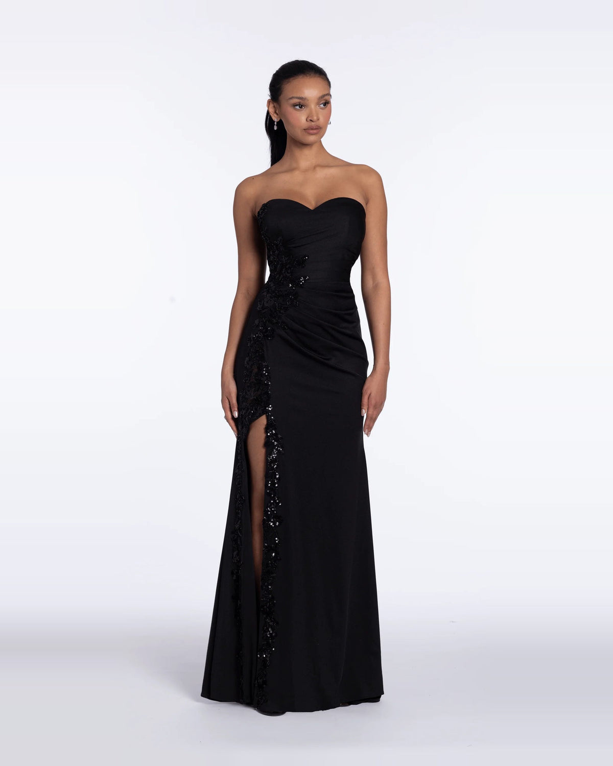 Black strapless sweetheart column maxi evening dress with ruched bodice and side slit