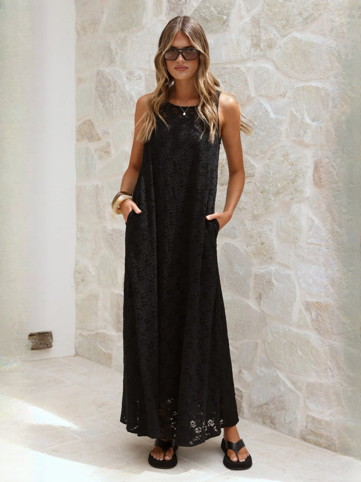 Black a-line maxi formal dress with V-neckline, full-length front view