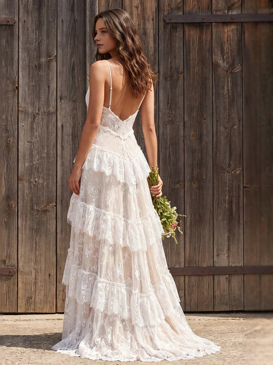 Ivory tiered lace wedding dress, low V-back with ruffled layers and slit